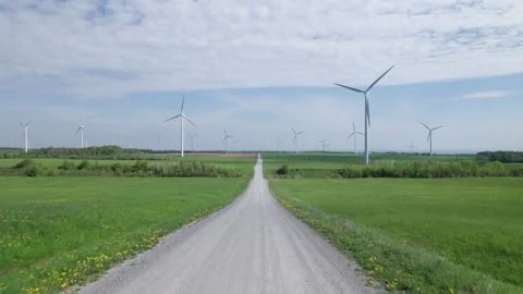 Moving Down a Dirt Road towards a Wind Farm Stockbeeldmateriaal 197569011