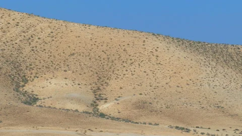 Moving down from far hills to silicon chips in desert Stock Footage 94443140