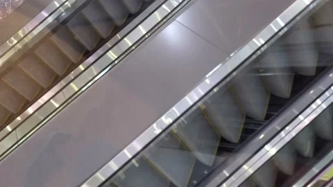 Moving down inside escalator in empty shopping mall Stock Footage 157782163