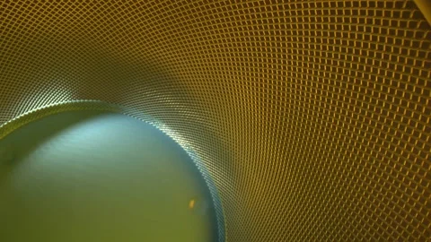 Moving down a metal grid where the base is blue, grid is gold. Wide angle Stock Footage 162308575