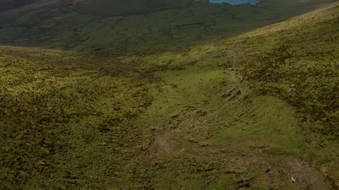 Moving down the slope of caldera. Aerial of Caldeirao volcano of Corvo island Stock Footage 119600357