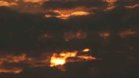 Moving down sun behind clouds Stock Footage 150546998