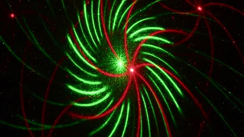 Moving drawings with rays of light of green and red colors on a black background Stock Footage 305020378