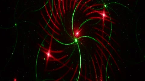 Moving drawings with rays of light of green and red colors on a black background Stock Footage 305020380