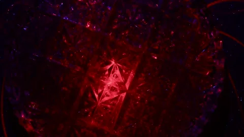 Moving drawings with rays of light of green and red colors on a black background 動画素材 305020692