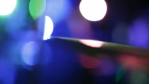 Moving drum-plate on multicolor bokeh background Vidéo 75582040