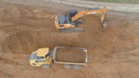 Moving earth during a construction project Stock Photos