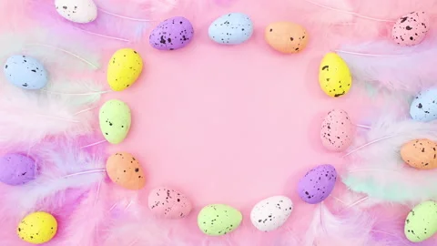 Moving Easter eggs with feathers and place for text. Stop motion 動画素材 147738157