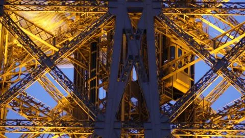Moving elevators of the Eiffel tower in Paris, France. Telephoto lens shot Stock Photos