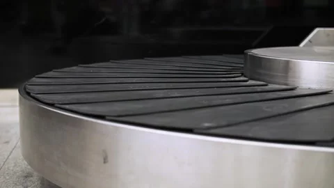 Moving empty baggage carousel at the airport Stock Footage 292387673