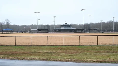 Moving by an empty ball field Stock Footage 121386964