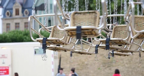 Moving empty seat without people of swing ride or swing carousel Stock Footage 113703133