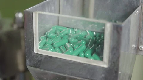 Moving empty two-piece blue-green hard capsules Stock Footage 102456835