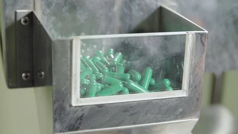 Moving empty two-piece blue-green hard capsules Stock Footage 102456983