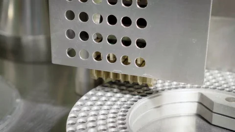 Moving equipment with blue-green hard shelled capsules Stock Footage 102455205