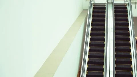 Moving escalator up and down, mecanic, electic, Stair and escalators in a public Stock Photos