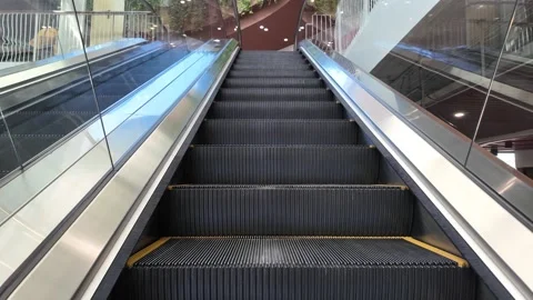 Moving escalator going up in modern mall Stock Footage 325789950