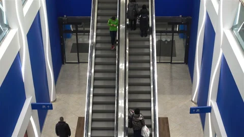 Moving escalators with people in 4K Stock Footage 148101100