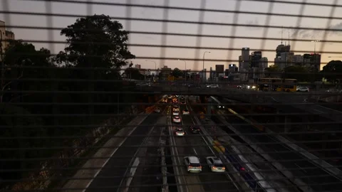Moving evening Sydney traffic flow pan to pedestrian with shopping bags 6K Stock Footage 307875057