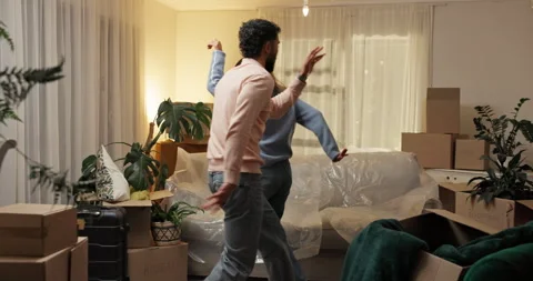 Moving in, excited or couple with dancing in new house for property investment Stockbeeldmateriaal 312376253