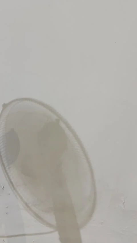 Moving Fast Fan Shadow on Textured White Wall Vertical Video Stock Footage 334575163