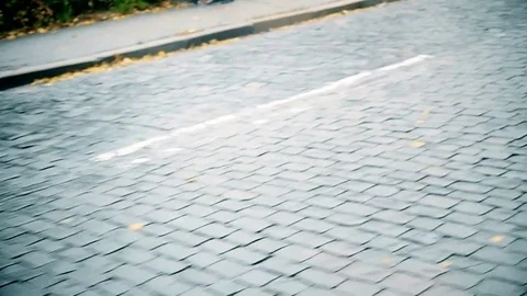 Moving fast over cobble stone paving road Stock Footage 71266546
