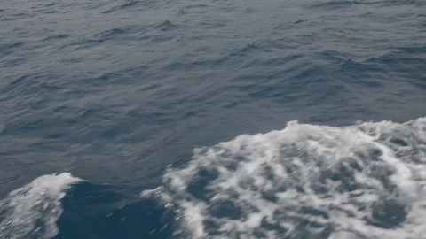 Moving on the foamed waves of the blue sea Stock Footage 111428628