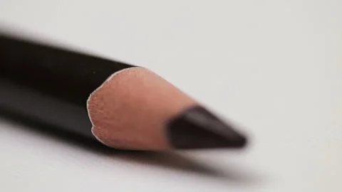 Moving focus on a sharp tip of black wooden pencil, macro view Stock Footage 96340008