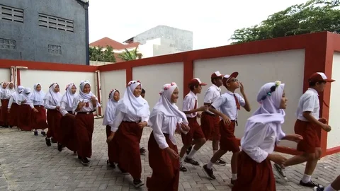 Moving footage of row students run to the school field. Back to school concept Stock Footage 108398988