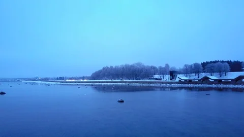 Moving forward aerial shot through smooth winter sea. Misty cold winter sea. Stock Footage 100127878