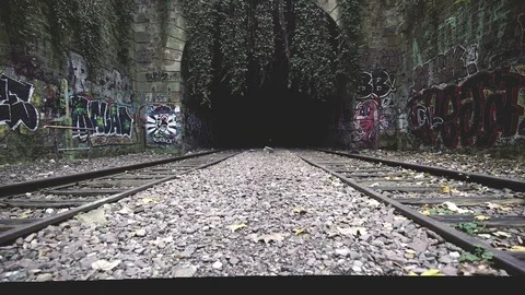 Moving forward along train tracks into a Paris train tunnel covered in Stock Footage 101303175