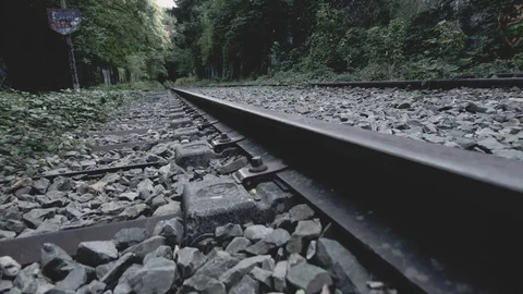 Moving forward along train tracks in a Paris subway outdoor route covered Stock Footage 101303206