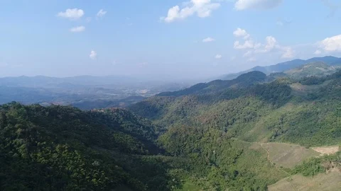 Moving forward to forest and mountain valley, aerial shot Stock Footage 104924740