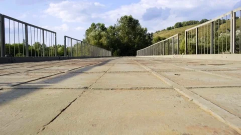 Moving forward on an iron rusty bridge Stock Footage 117693504
