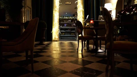 Moving forward through restaurant dining hall toward festive lights Stock Footage 106810614