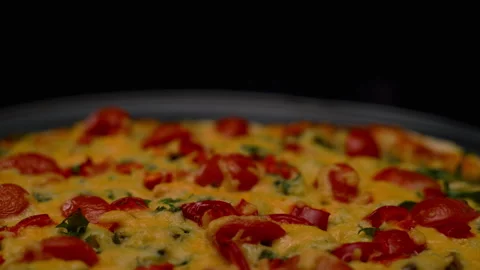 Moving forward with a turn, freshly baked pizza with cheese and tomatoes on a Stock Footage 173226519