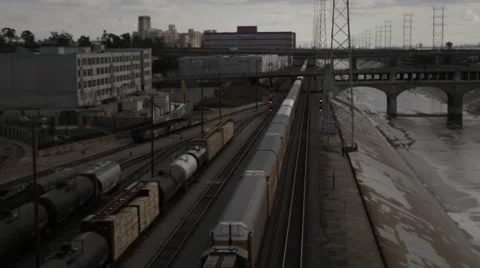 Moving freight train carrying storage containers in downtown Los Angeles Stock Footage 59583067