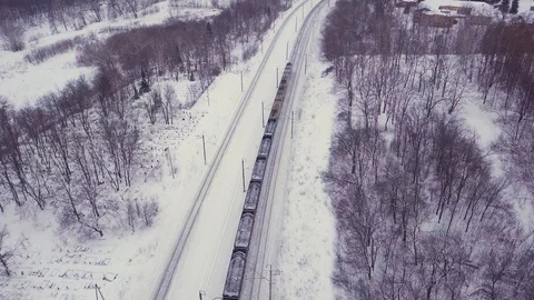 Moving freight train in the countryside at winter Stock Footage 122756314