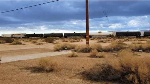 Moving Freight Train in Desert Stock Footage 164085112