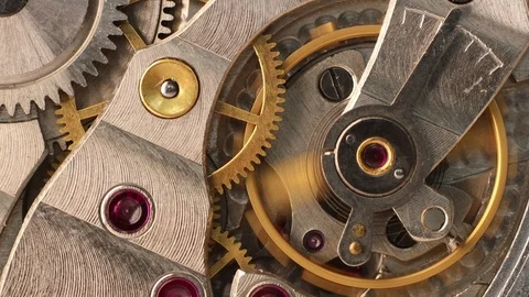 Moving gears inside old mechanic pocket watch Stock Footage