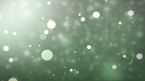 Moving gloss particles on green backgrou... | Stock Video | Pond5