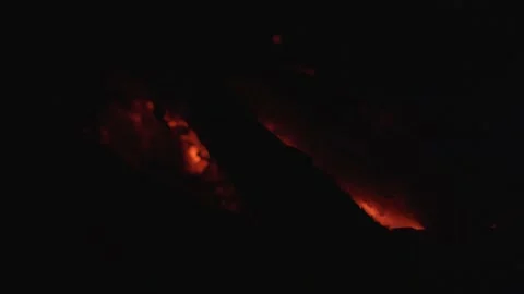 Moving glowing ember restarting fire, flames in campfire, 4K Stock Footage 133903369