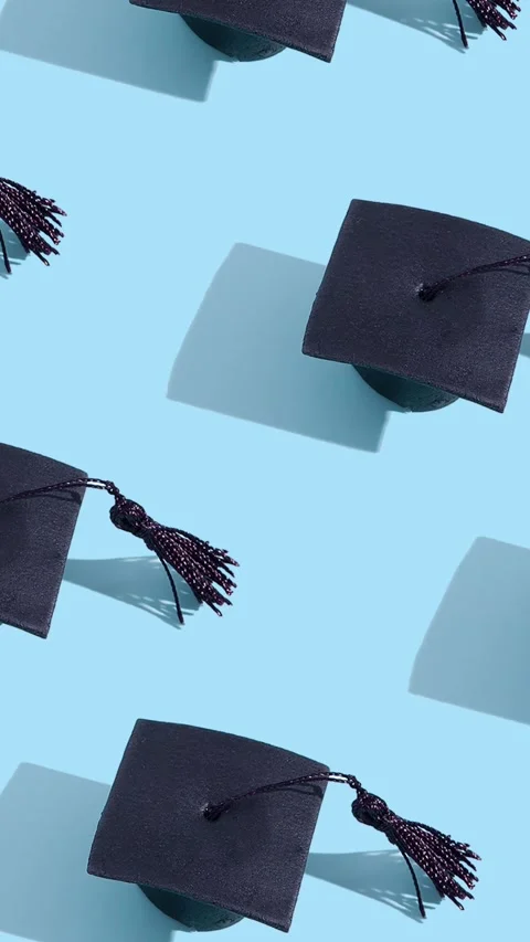 Moving graduated cap pattern. Education concept motion background Stock Footage 240207174