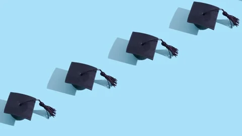 Moving graduated cap pattern. Education concept motion background Stock Footage 240207203