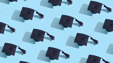 Moving graduated cap pattern. Education concept motion background Stock Footage 240207213