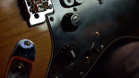 Moving guitar knobs during practice in home studio 스톡 동영상 128298463