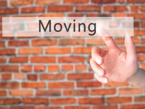 Moving - Hand pressing a button on blurred background concept on visual scree Stock Photos