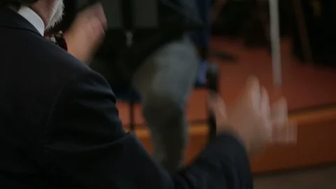 The moving hands of an orchestra conductor directing the musicians Stock-Footage 100601673