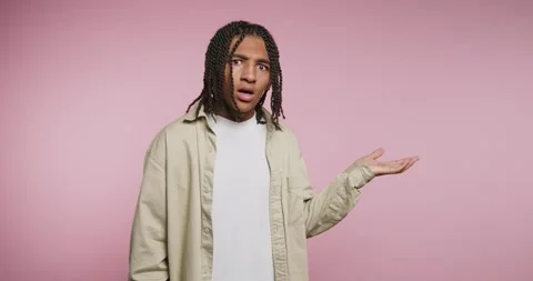 Moving hands while talking in a studio with pink background and natural lig.. Stock-Footage 326788213