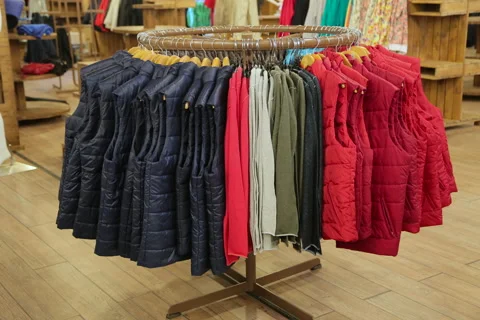 Moving hanger with clothes in store Stock Footage 67498934